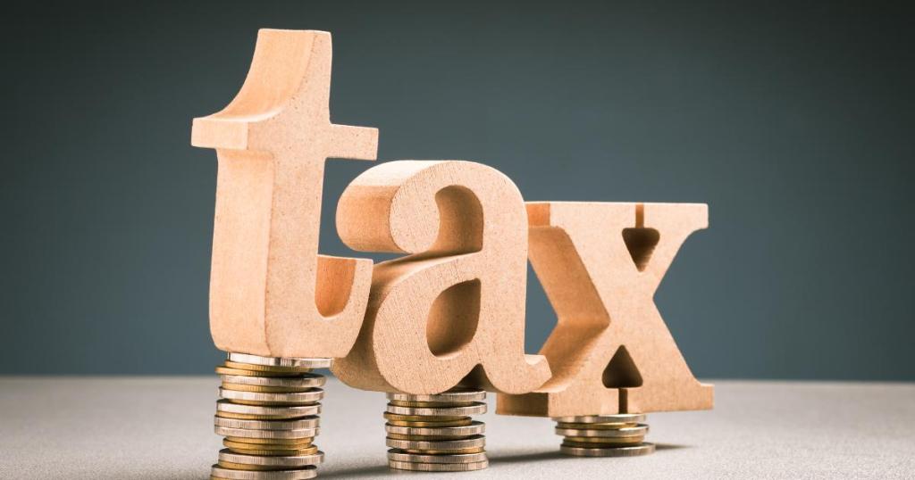 Graphic of the word 'TAX' in bold, block letters aimed at this tax season.