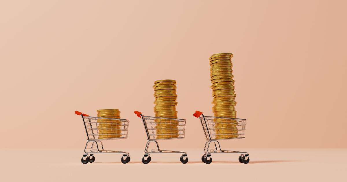 Graphic of three shopping carts filled with gold coins, symbolizing wealth and inflation.